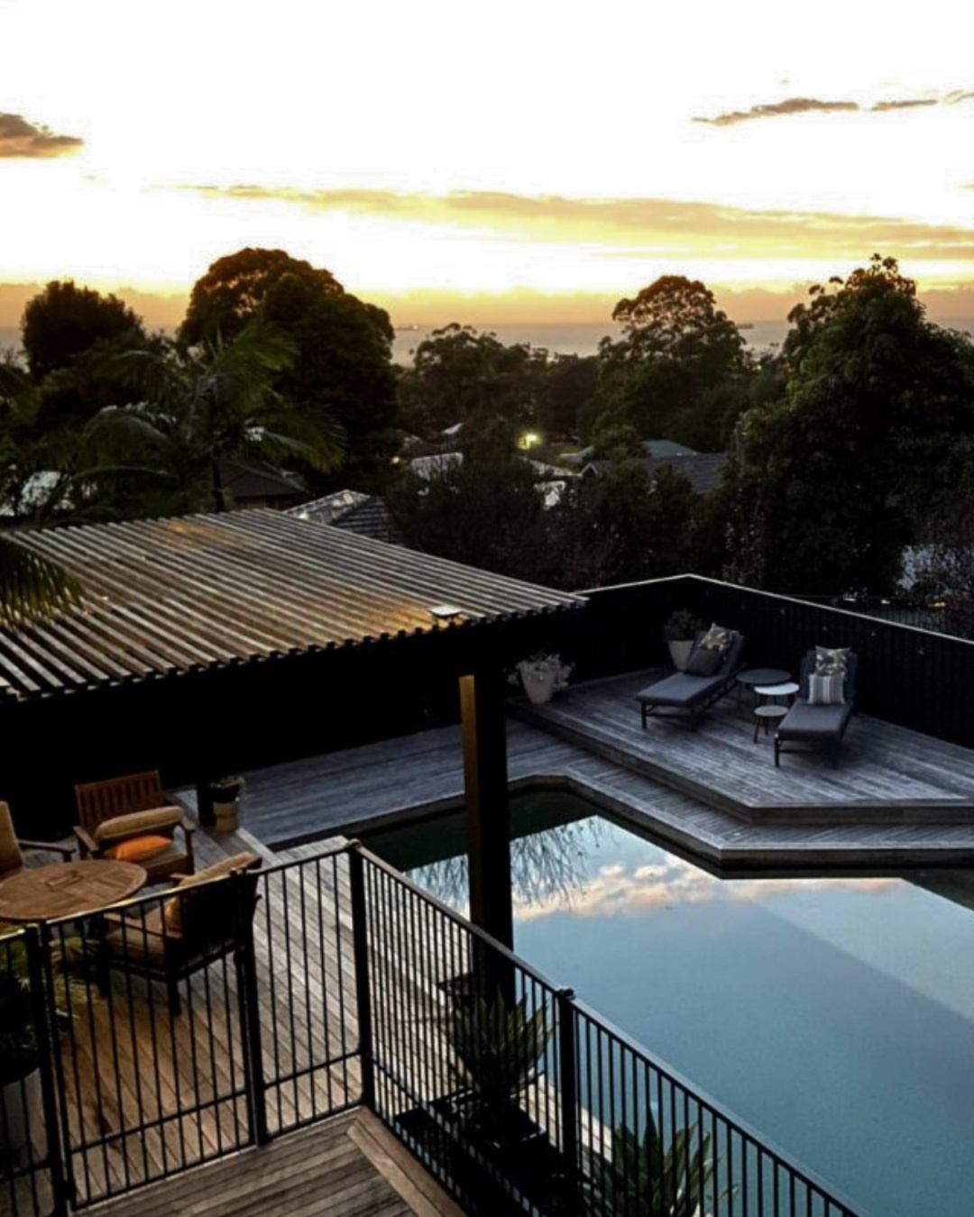 Completed outdoor living area with pool, timber deck, and pergola at sunset, designed and built by CKS Projects for a Wollongong Illawarra property, showing the quality outcome that detailed construction documentation makes possible